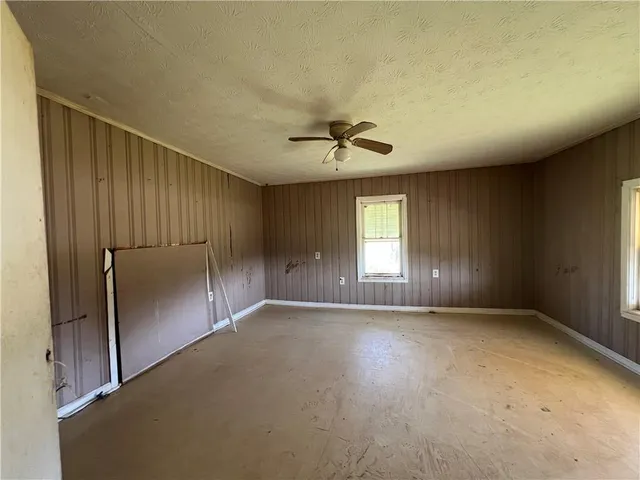 a room with a refrigerator and cabinets