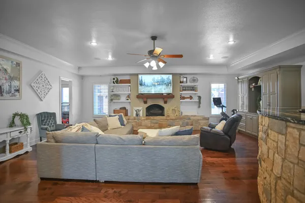a living room with furniture and a fireplace