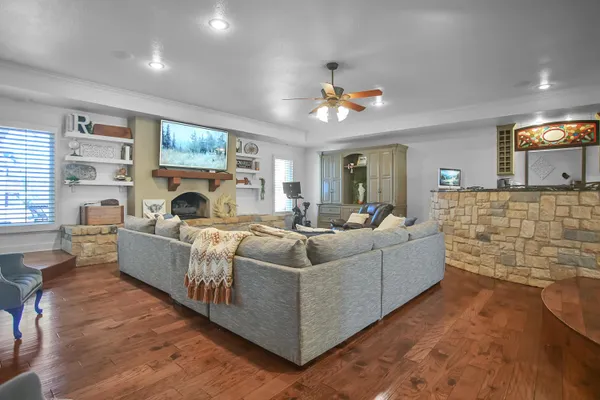 a living room with furniture and a fireplace