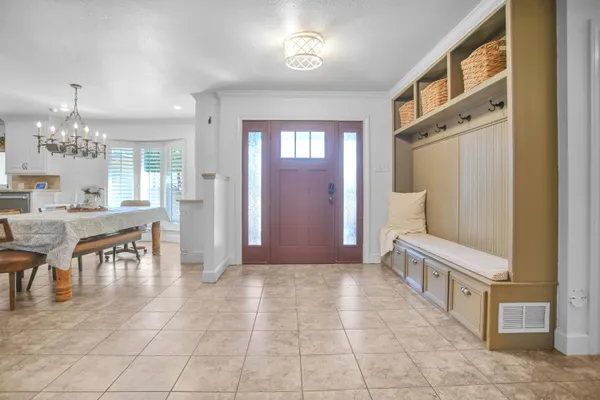 a kitchen with granite countertop a sink stainless steel appliances and cabinets