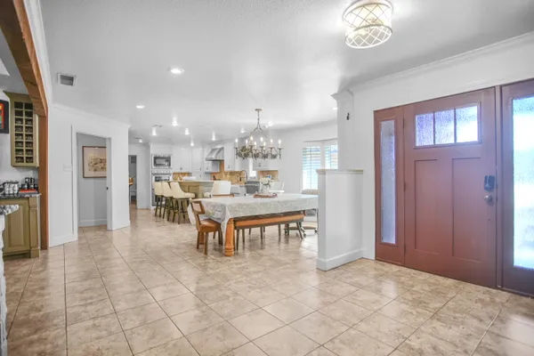 a kitchen with granite countertop a stove sink and cabinets
