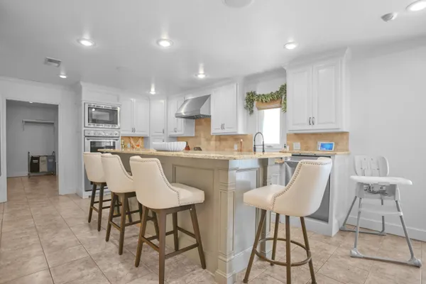 a bathroom with a sink a vanity and a mirror