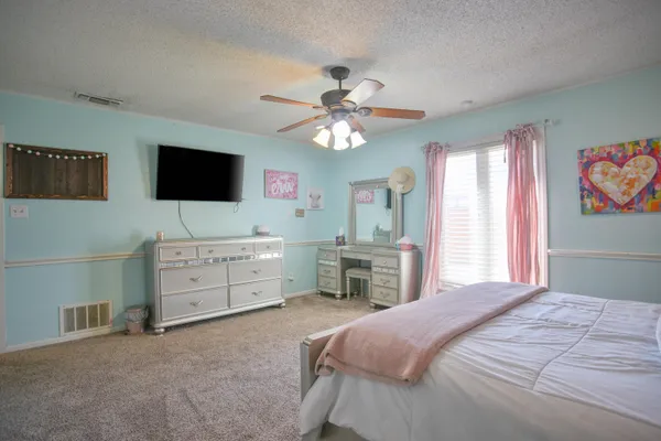 a kitchen with a sink and a refrigerator
