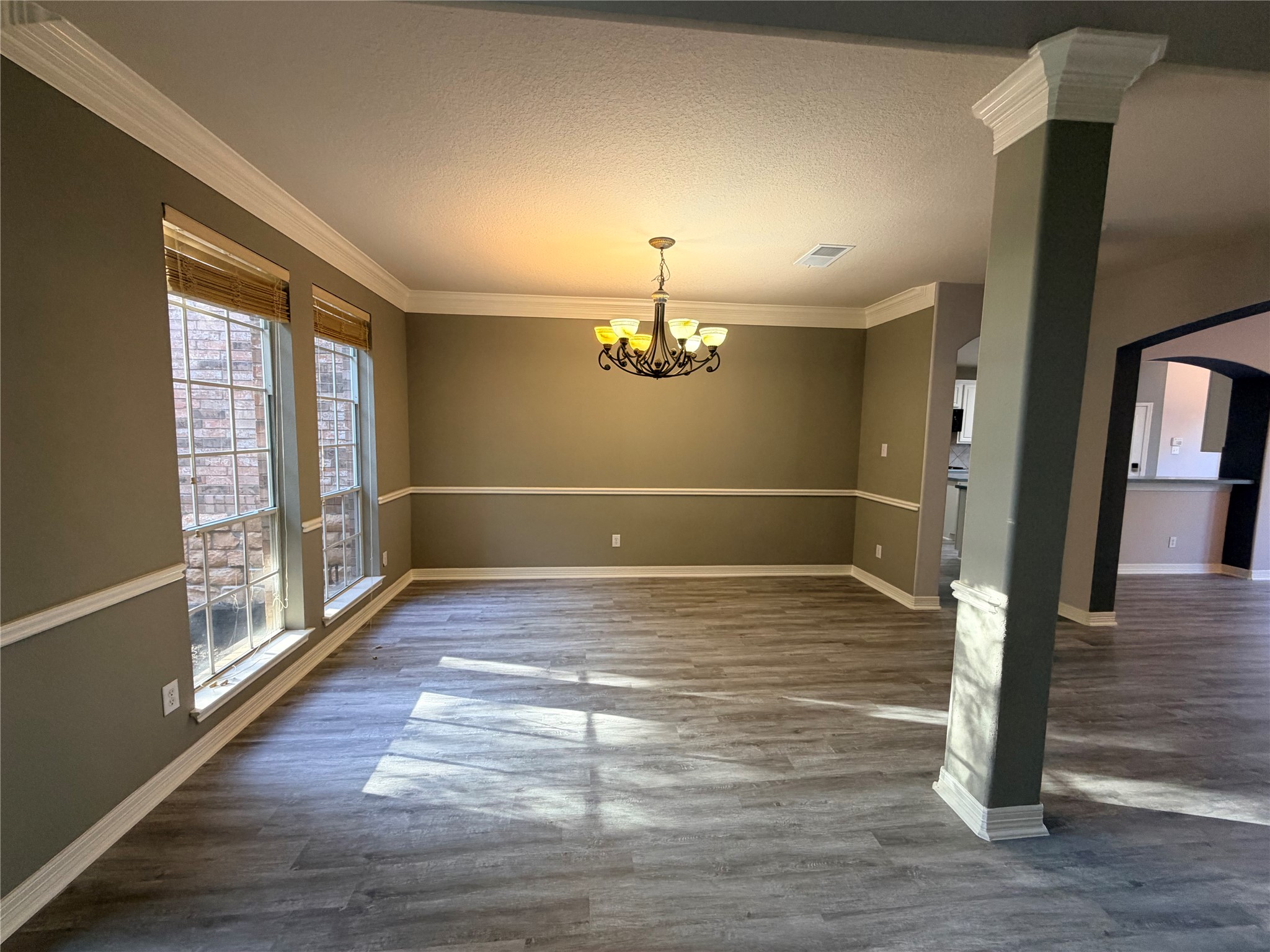 2303 Chelsea Ridge Court Katy, TX 77450 - Photo 11 of 12 a view of an empty room with wooden floor and a window