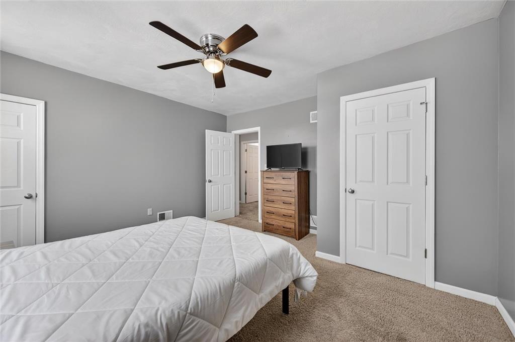 126 West Ranson Avenue Blairsville, PA 15717 - Photo 17 of 27 a bedroom with a bed and a ceiling fan