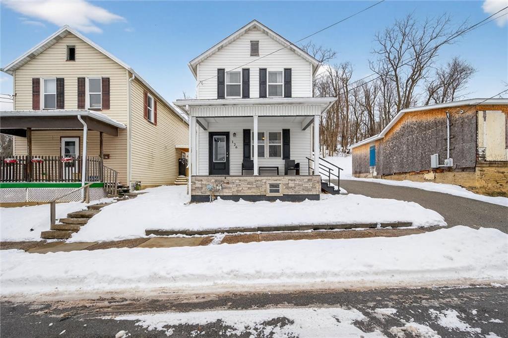 126 West Ranson Avenue Blairsville, PA 15717 - Photo 3 of 27 a view of white house with a yard and large tree