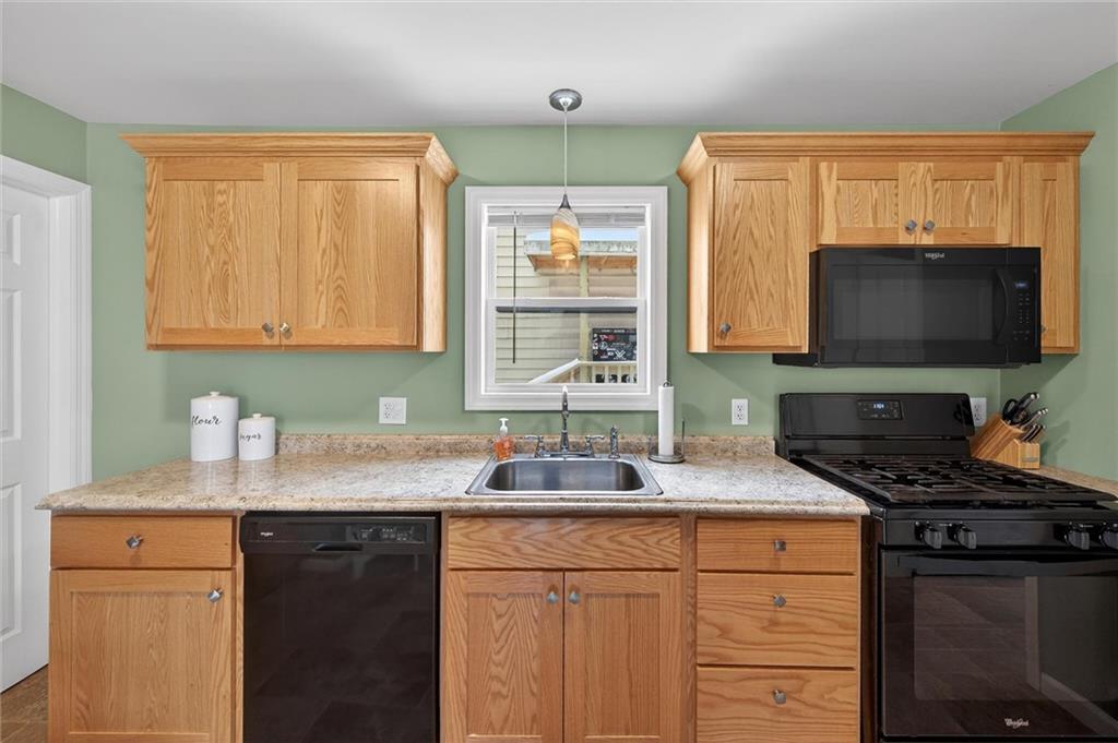 126 West Ranson Avenue Blairsville, PA 15717 - Photo 8 of 27 a kitchen with granite countertop a sink stainless steel appliances and cabinets