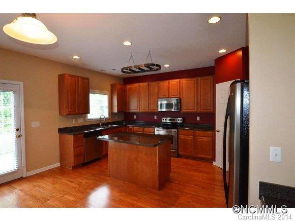 283 Wildbriar Road Fletcher, NC 28732 - Photo 2 of 13 a kitchen with stainless steel appliances granite countertop a stove a refrigerator and a sink