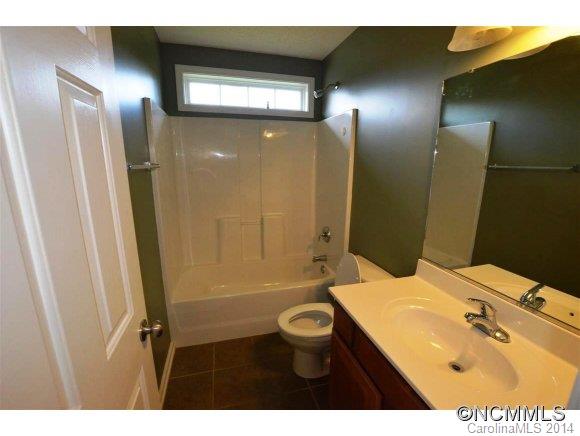 283 Wildbriar Road Fletcher, NC 28732 - Photo 11 of 13 a bathroom with a sink and mirror