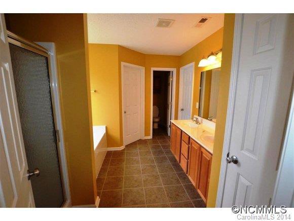 283 Wildbriar Road Fletcher, NC 28732 - Photo 12 of 13 a bathroom with a sink and a mirror