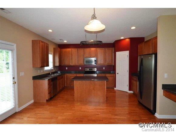 283 Wildbriar Road Fletcher, NC 28732 - Photo 4 of 13 a kitchen with stainless steel appliances granite countertop a refrigerator a sink a stove and a refrigerator