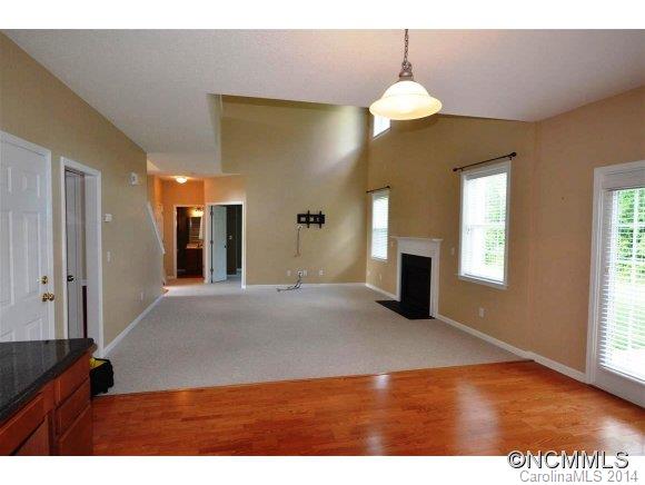 283 Wildbriar Road Fletcher, NC 28732 - Photo 6 of 13 a view of an empty room with window and wooden floor