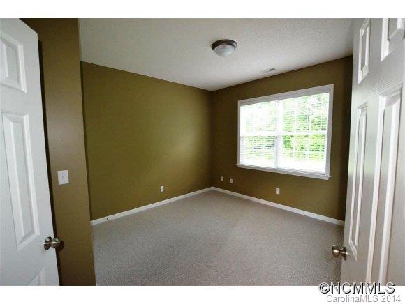 283 Wildbriar Road Fletcher, NC 28732 - Photo 7 of 13 a view of an empty room with a window