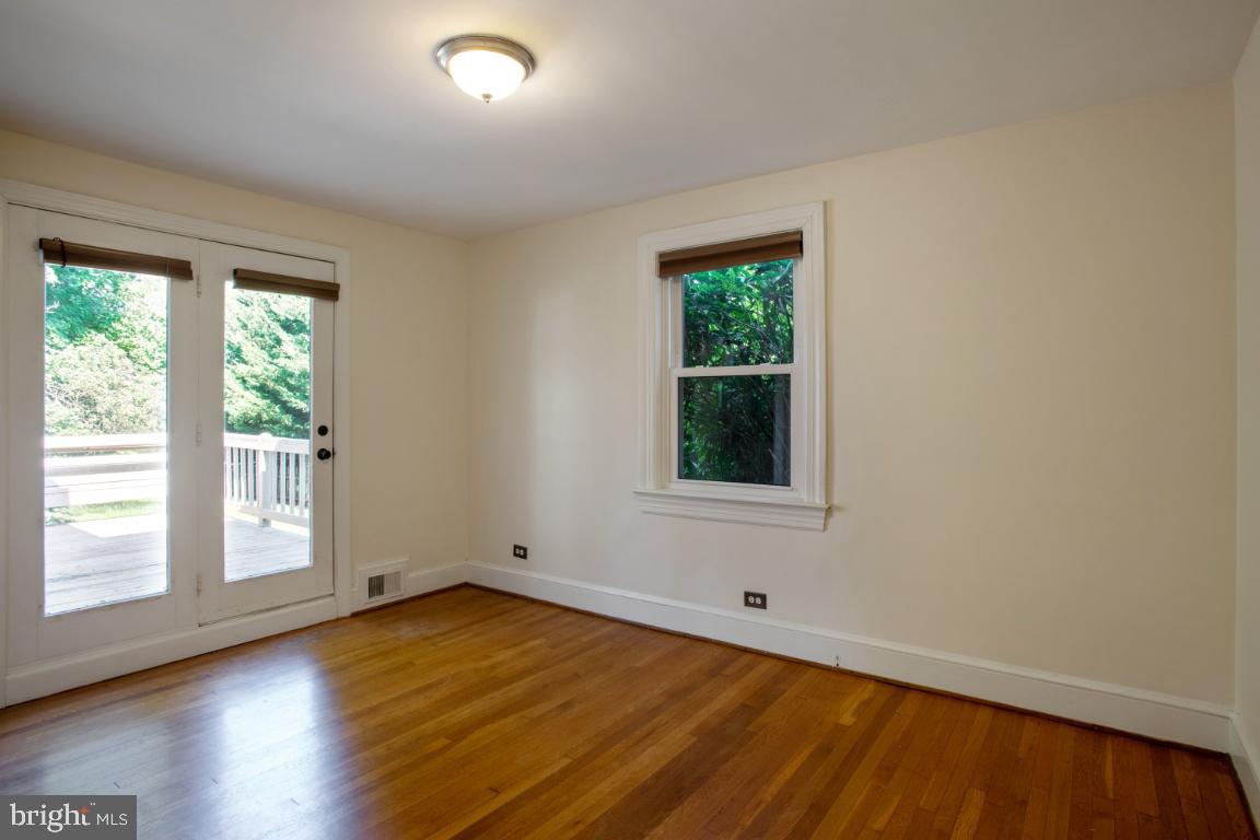 1136 South Blue Ridge Avenue Culpeper, VA 22701 - Photo 14 of 38 Master bedroom looking out onto deck