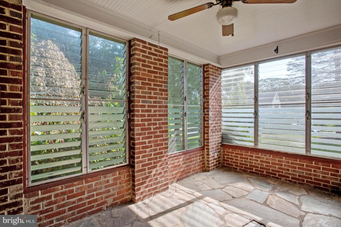 1136 South Blue Ridge Avenue Culpeper, VA 22701 - Photo 29 of 38 Sunroom off family room with slate flooring