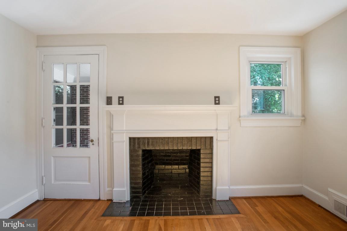 1136 South Blue Ridge Avenue Culpeper, VA 22701 - Photo 7 of 38 Family room with wood fireplace