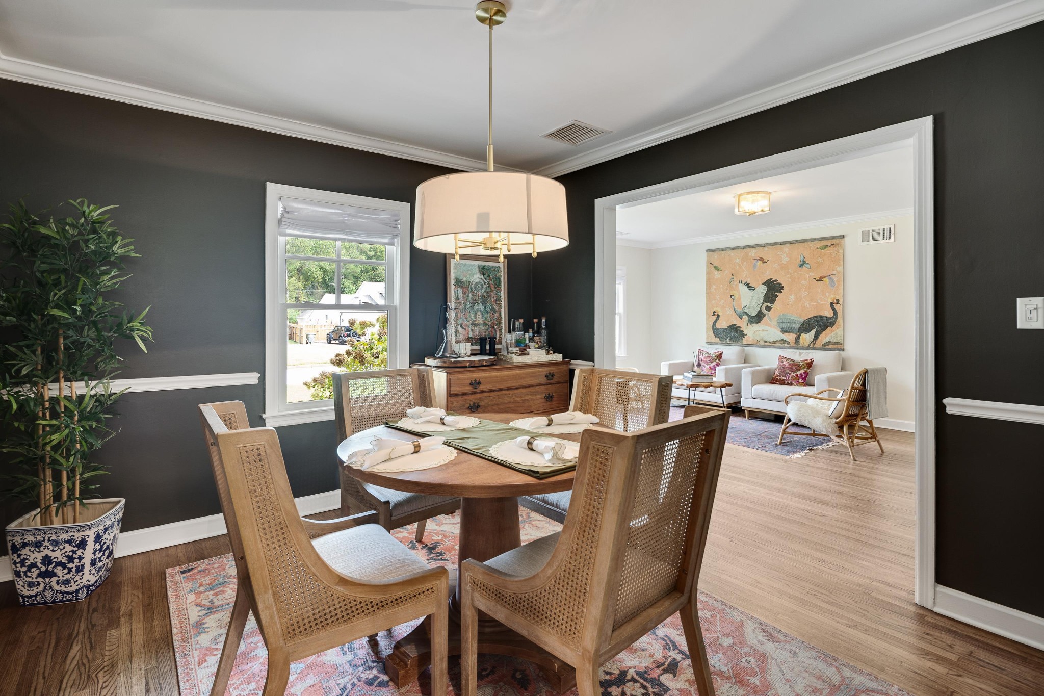 267 Barry Road Memphis, TN 38117 - Photo 9 of 40 a dining room with furniture a chandelier and wooden floor