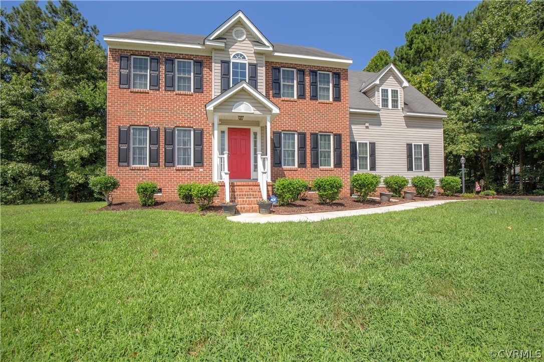 5300 Takach Road Prince George, VA 23875 - Photo 1 of 35 a front view of a house with a yard and trees