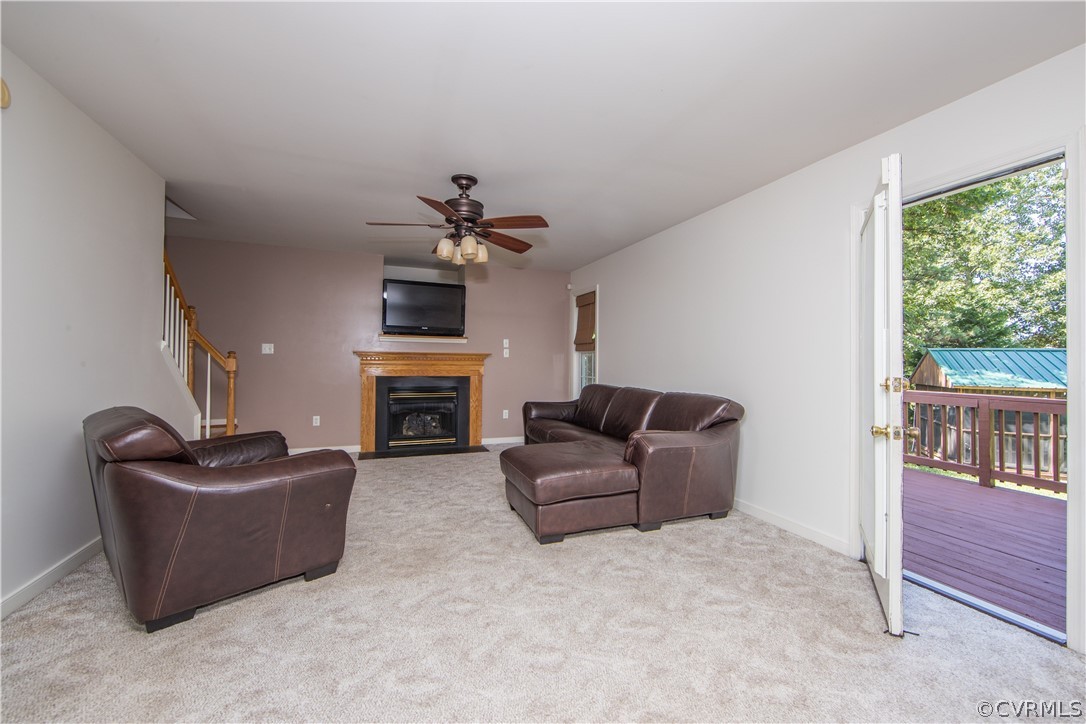 5300 Takach Road Prince George, VA 23875 - Photo 12 of 35 a living room with furniture a fireplace and a flat screen tv