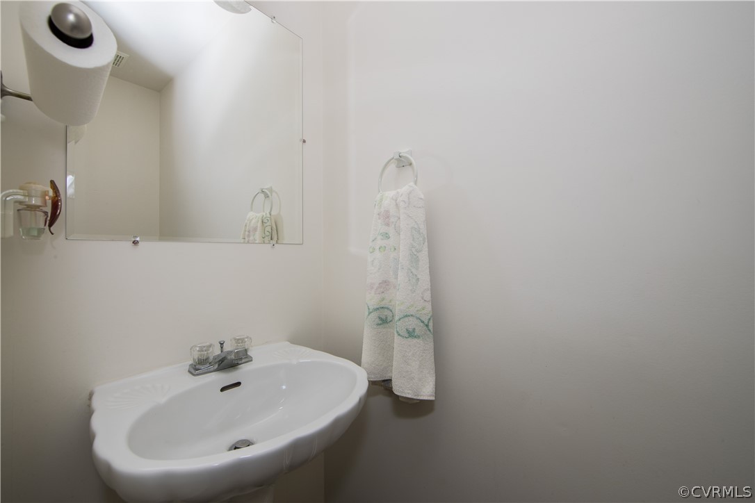 5300 Takach Road Prince George, VA 23875 - Photo 14 of 35 a bathroom with a sink and mirror