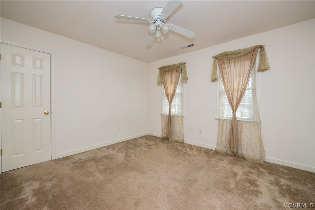 5300 Takach Road Prince George, VA 23875 - Photo 21 of 35 an empty room with windows and closet