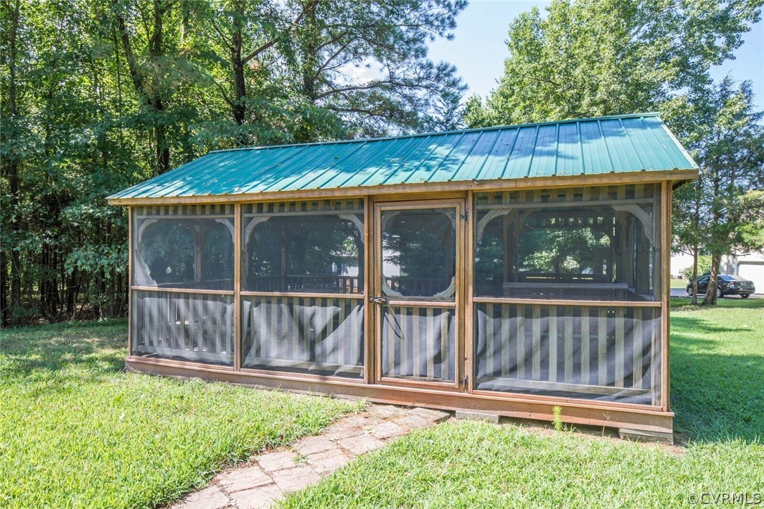 5300 Takach Road Prince George, VA 23875 - Photo 32 of 35 a view of a small house with a yard balcony a small yard
