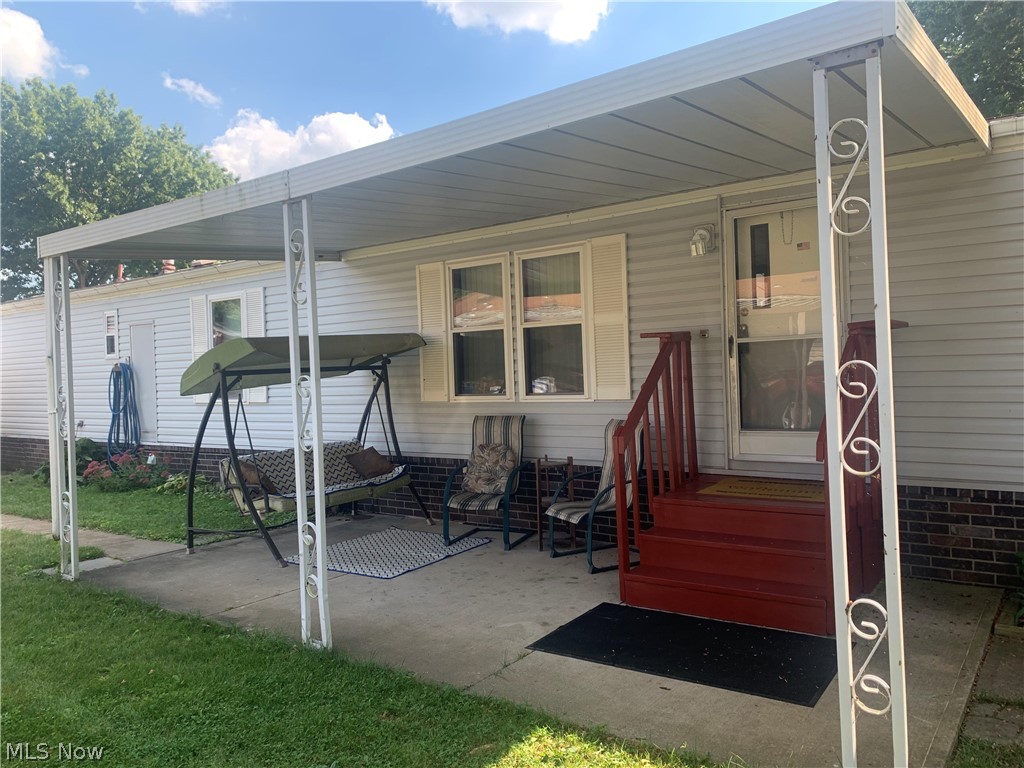 65 F Street Southwest Navarre, OH 44662 - Photo 2 of 11 View of home with the covered porch.