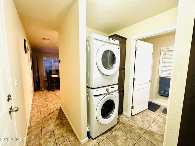 a view of a hallway with washer and dryer