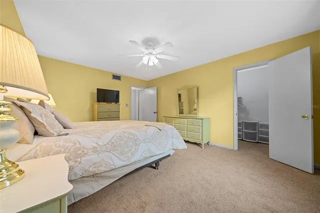 a bathroom with a sink mirror vanity and toilet