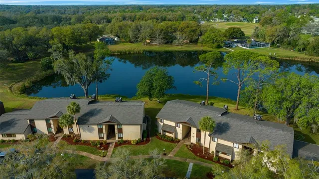 an aerial view of a house with yard swimming pool and outdoor seating
