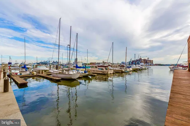 a kitchen with stainless steel appliances granite countertop wooden cabinets a oven and granite counter tops