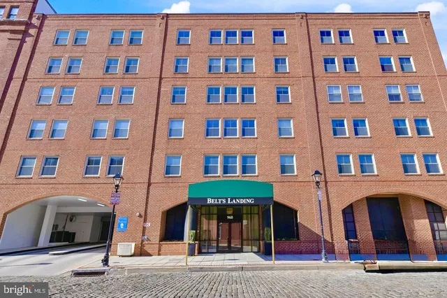 a kitchen with stainless steel appliances granite countertop a sink and a stove