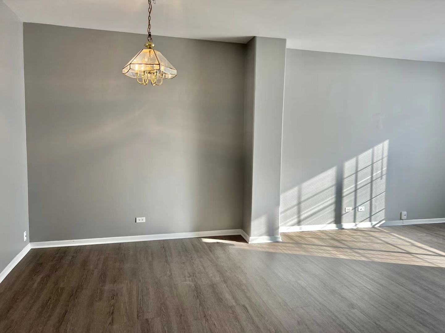 3367 Ravinia Circle Aurora, IL 60504 - Photo 4 of 14 an empty room with wooden floor and windows