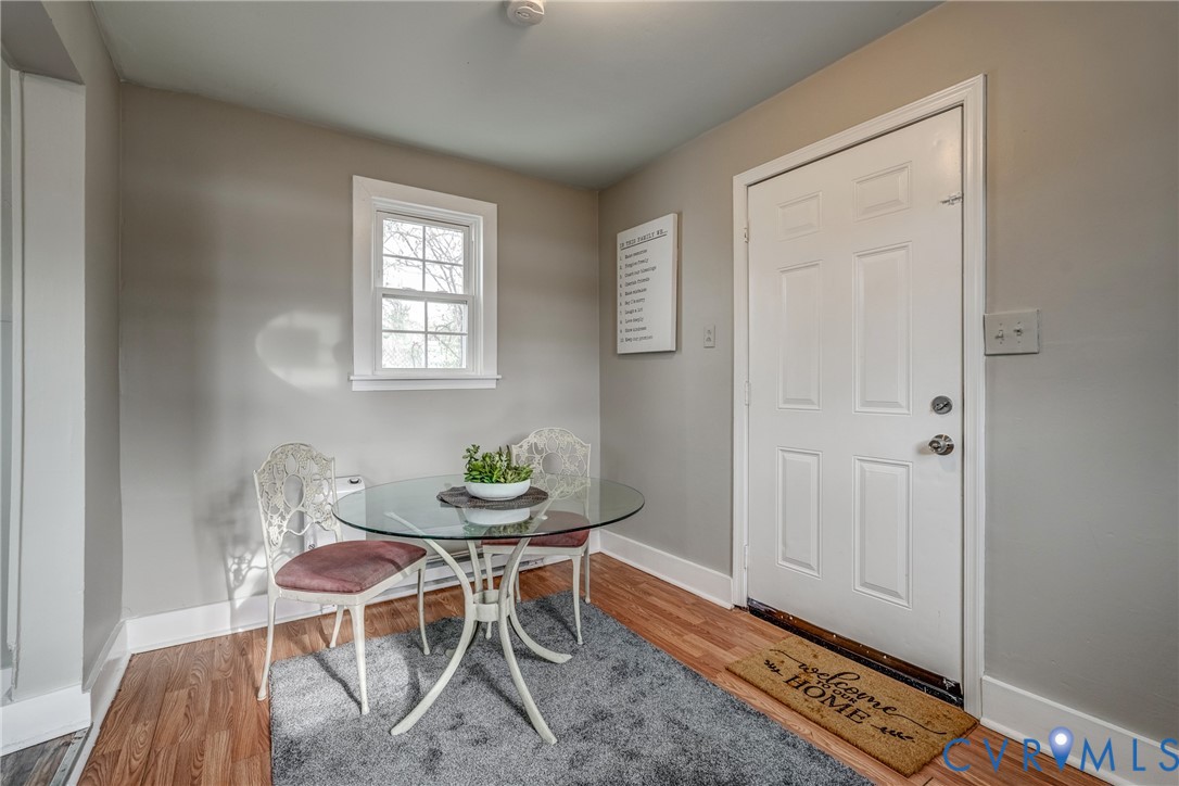 1411 Hopkins Road Richmond, VA 23224 - Photo 6 of 13 a dining room with furniture and window