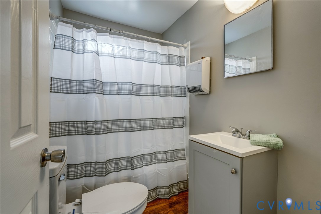 1411 Hopkins Road Richmond, VA 23224 - Photo 8 of 13 a bathroom with a sink toilet and shower