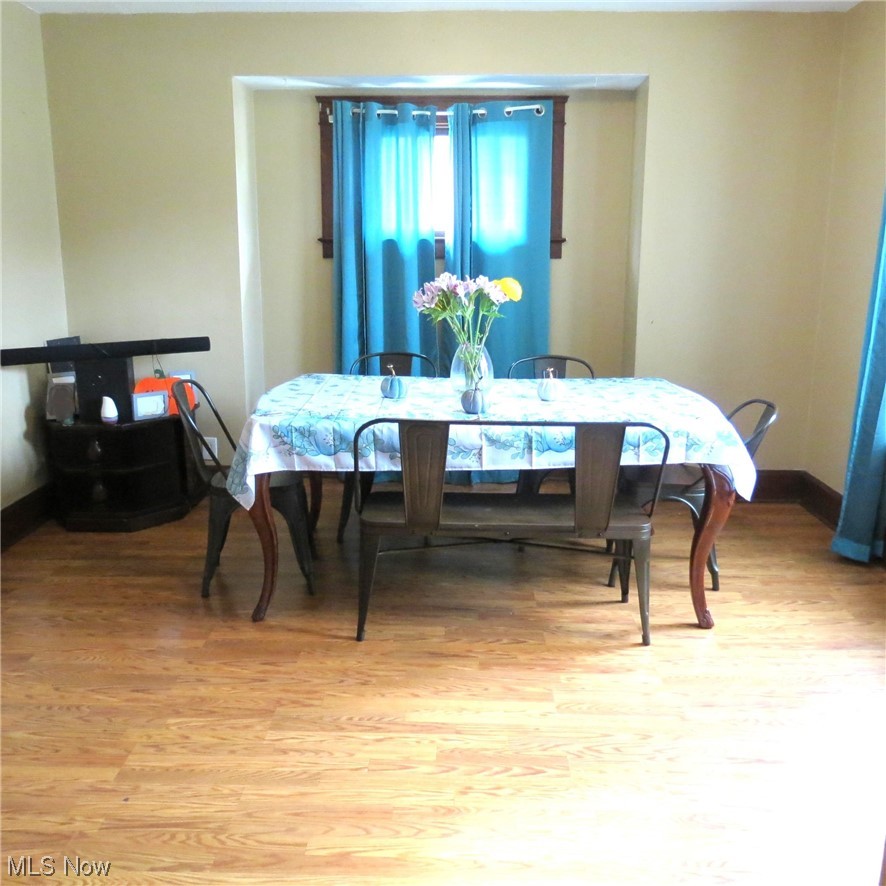 Dining space featuring wood-type flooring