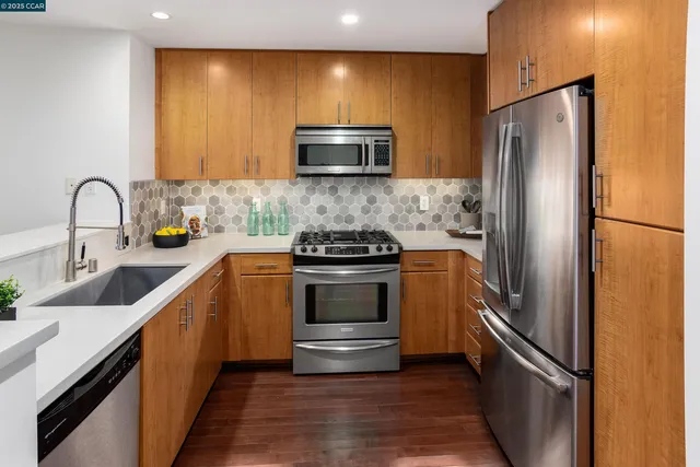 a kitchen with a refrigerator and a sink