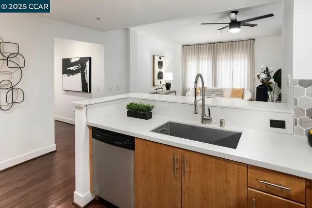 a kitchen with a sink and a refrigerator