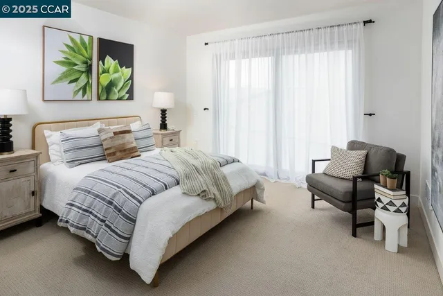 a bedroom with a bed and a couch