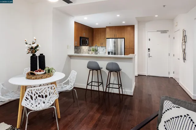a view of a dining room with furniture and wooden floor
