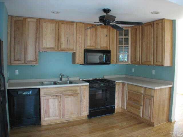 810 Faircloth Street Raleigh, NC 27607 - Photo 6 of 10 a kitchen with a sink and cabinets