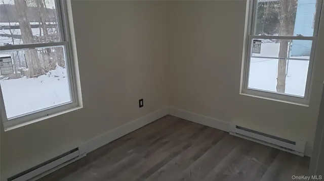 a view of a room that has a window in it