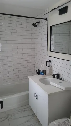 a bathroom with a sink and a bathtub