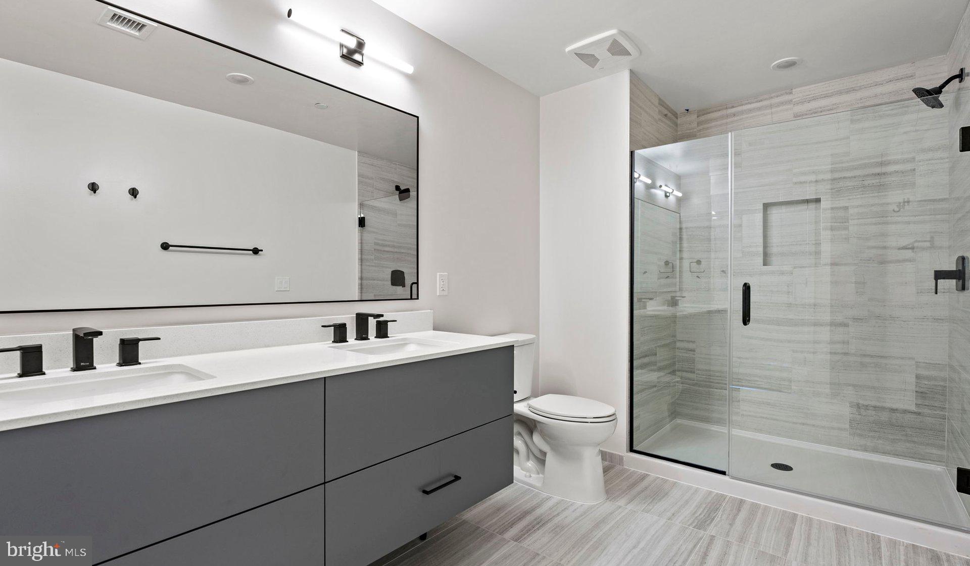 3990 Upton Street Northwest, Unit 2BPARC1108 Washington, DC 20016 - Photo 28 of 49 a bathroom with a sink and a mirror
