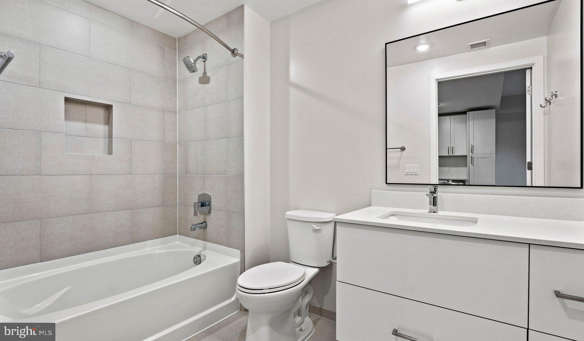 3990 Upton Street Northwest, Unit 2BPARC1108 Washington, DC 20016 - Photo 46 of 49 a bathroom with a sink toilet and shower