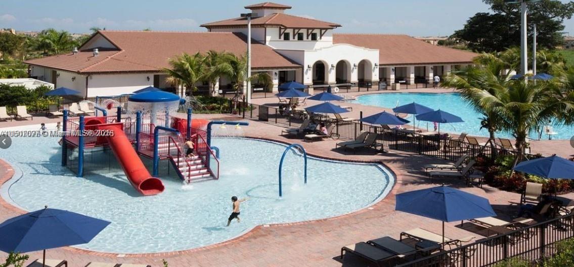 11343 Southwest 239 Street, Unit 11343 Homestead, FL 33032 - Photo 11 of 12 an outdoor space with lots of palm trees