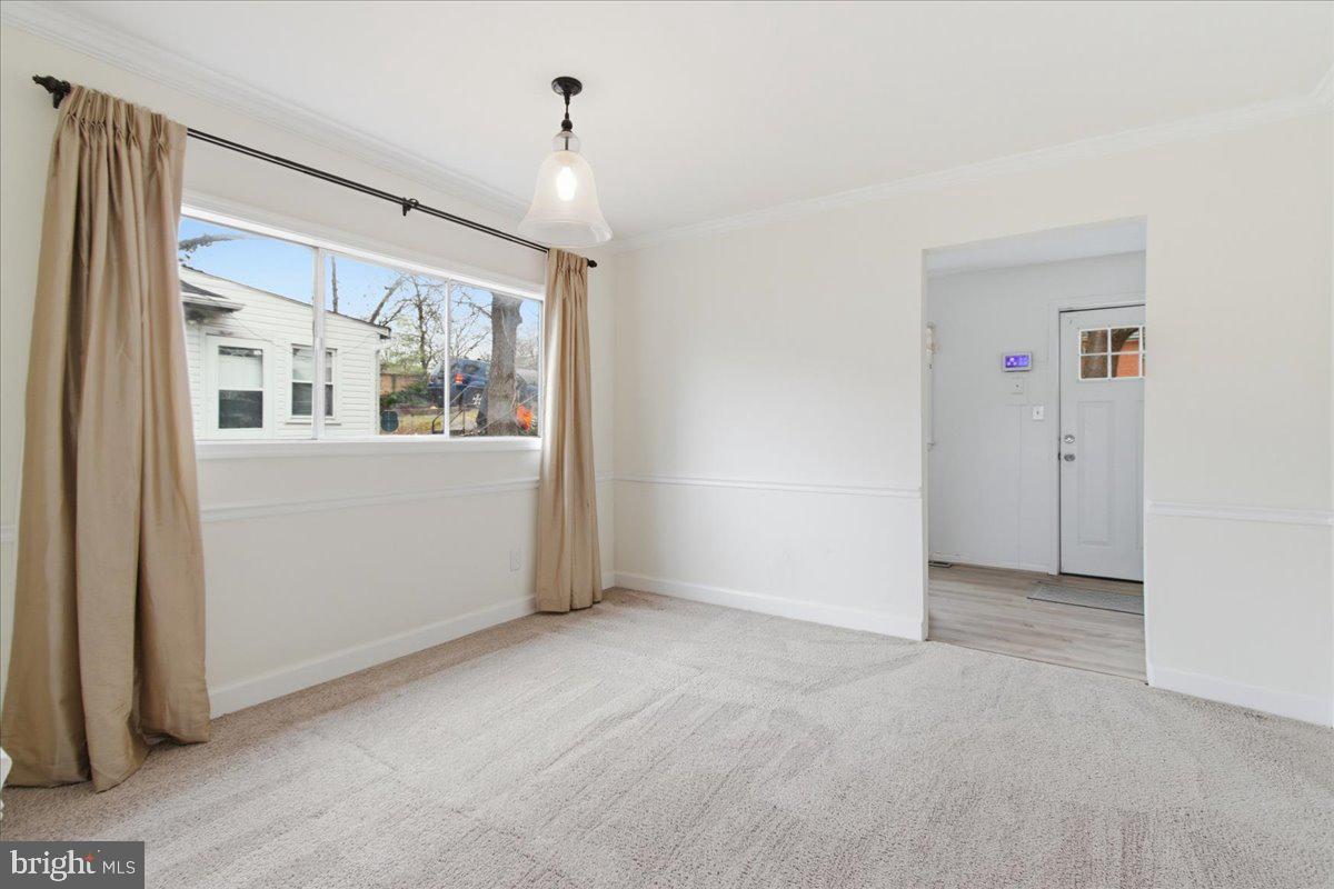 4705 Eads Street Northeast Washington, DC 20019 - Photo 7 of 16 an empty room with windows