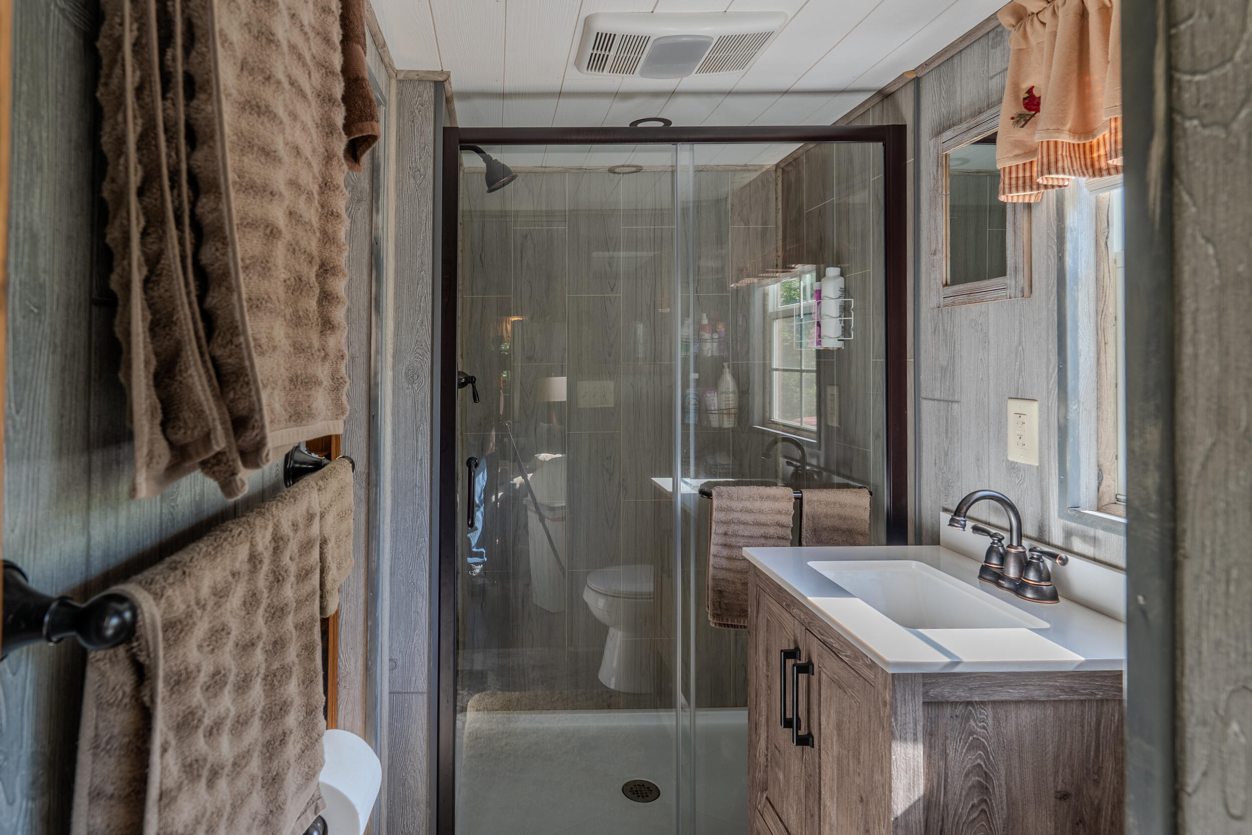 2100 Nemmo Road Vinton, VA 24179 - Photo 12 of 38 a bathroom with a granite countertop sink a mirror and shower