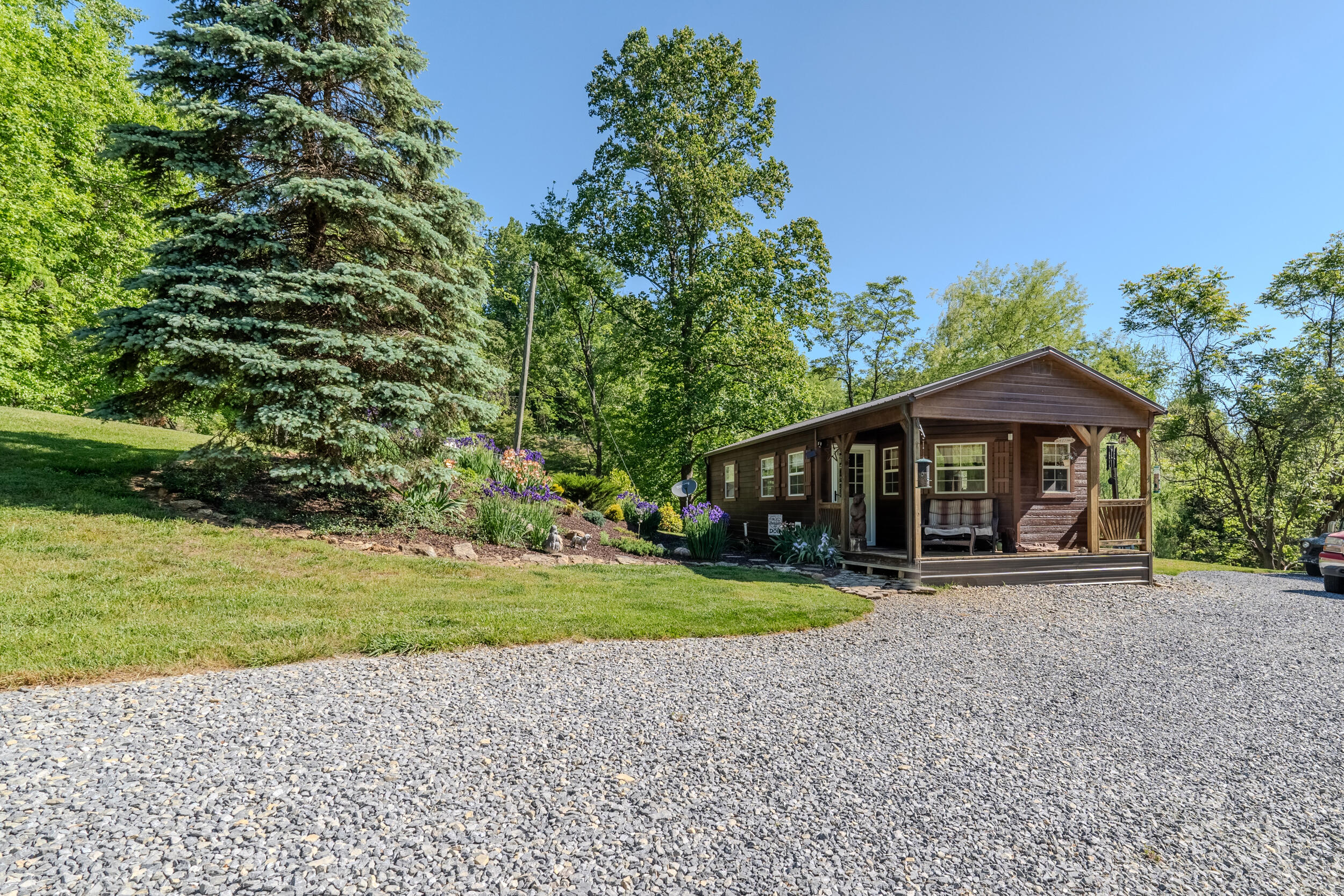 2100 Nemmo Road Vinton, VA 24179 - Photo 16 of 38 a front view of a house with a yard and garage
