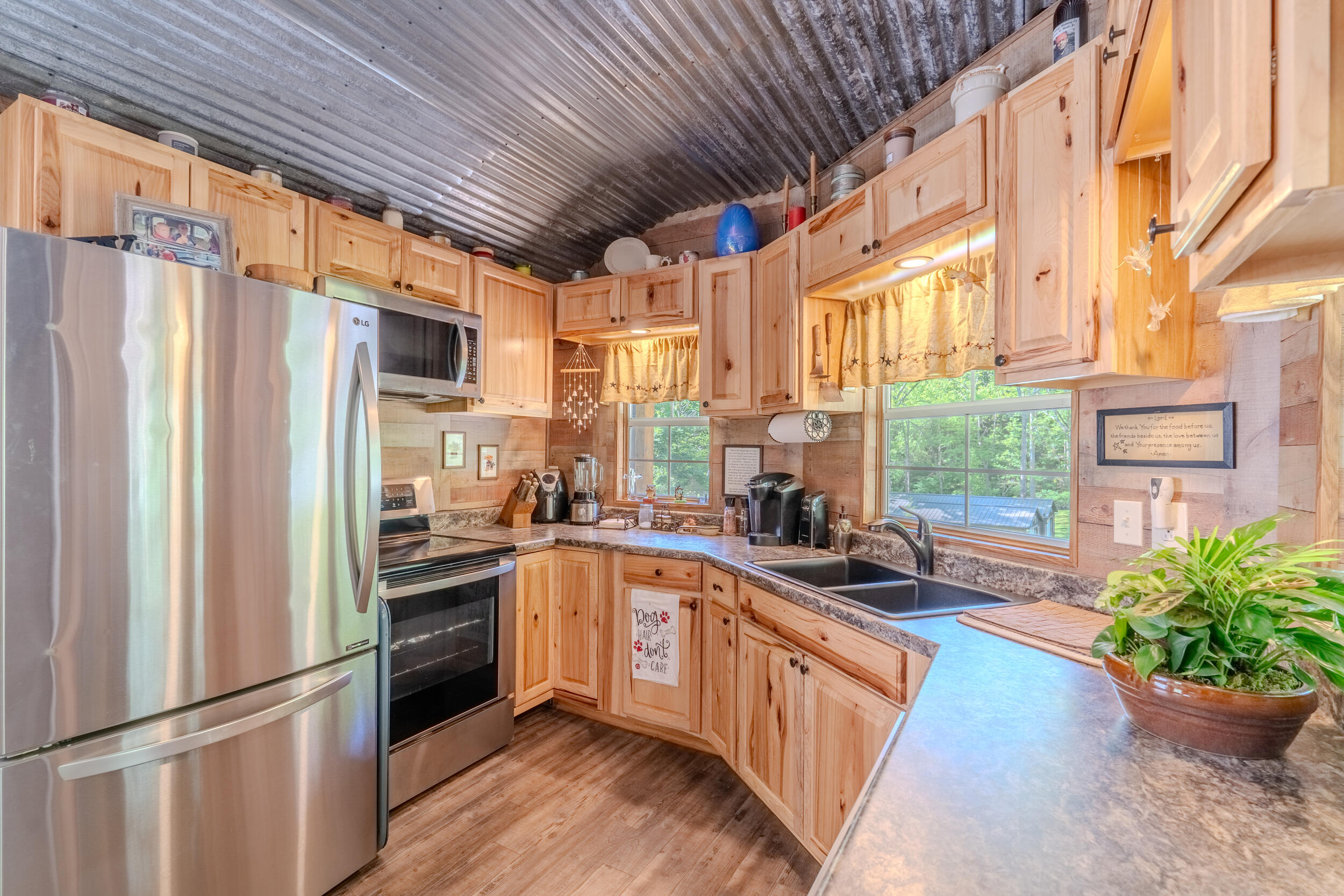2100 Nemmo Road Vinton, VA 24179 - Photo 2 of 38 a kitchen with stainless steel appliances granite countertop a refrigerator a sink dishwasher a stove and white countertops with wooden floor